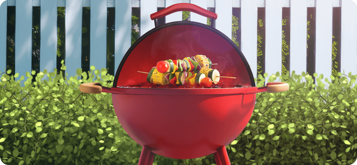 Classic red charcoal barbecue, lid open with two vegetable skewers sitting on the grill.