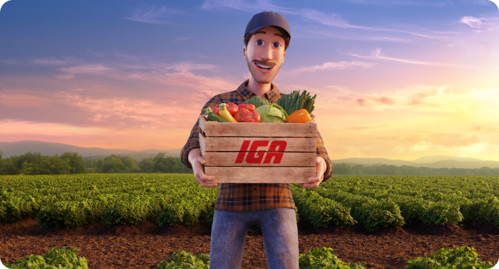 Agriculteur souriant présentant une caisse IGA remplie de fruits et légumes frais.