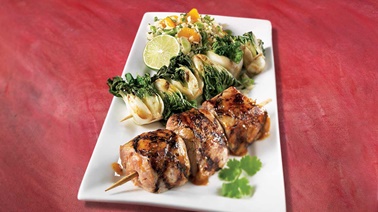 Honey-garlic pork tenderloin brochettes, bok choy brochettes and mandarin rice