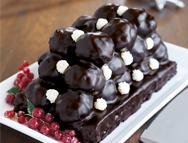 Profiterole Cake with Raspberry Drizzler and Berries