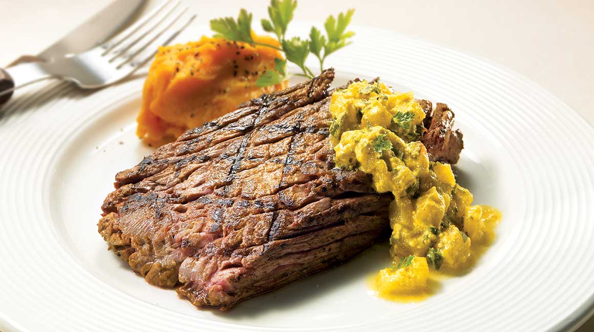 Marinated flank steaks with light turmeric and pineapple sauce