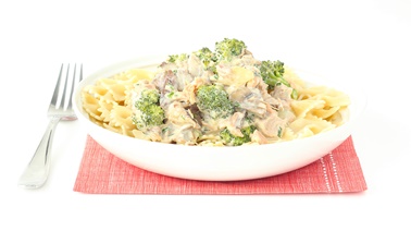 Bow tie pasta with braised pork, mushrooms, broccoli, and goat cheese