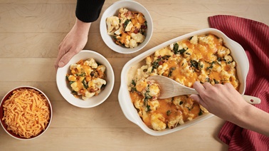 Casserole with cauliflower, spinach and old cheddar cheese