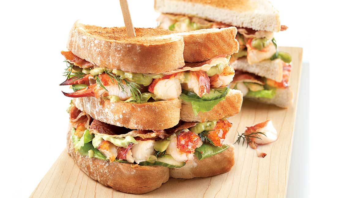 Lobster club sandwich with sweet lime mayonnaise and avocado