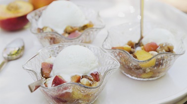Vanilla ice cream cups & peach, nuts & white chocolate toppings by Trois Fois par Jour