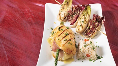 Chicken cutlets stuffed with asparagus and cheese with grilled endive and radicchio and herbs