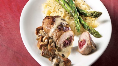 Brie and cranberry–stuffed milk-fed veal scallops with cream, mushroom and white wine sauce