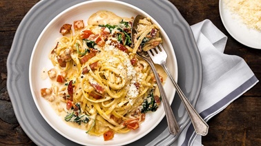 Carbonara-style linguine with bacon, tomato, and spinach