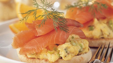 Scrambled eggs with smoked salmon on English muffins