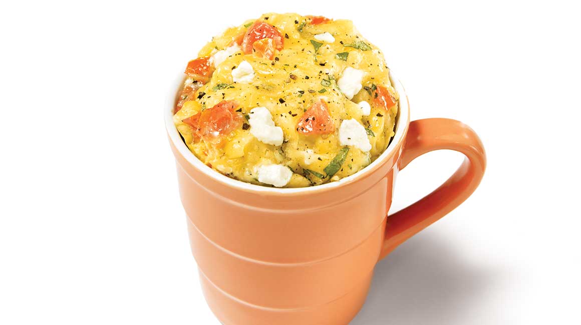Goat cheese and basil breakfast omelette in a mug