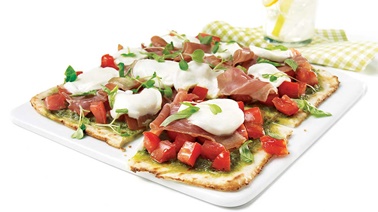 Grilled pizza with buffalo mozzarella and serrano ham