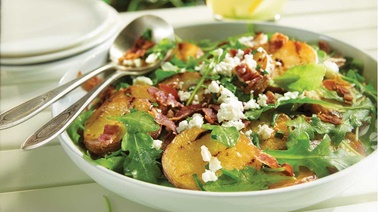 Grilled potatoes with feta and arugula