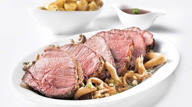 Top sirloin beef roast with mushrooms and blue cheese